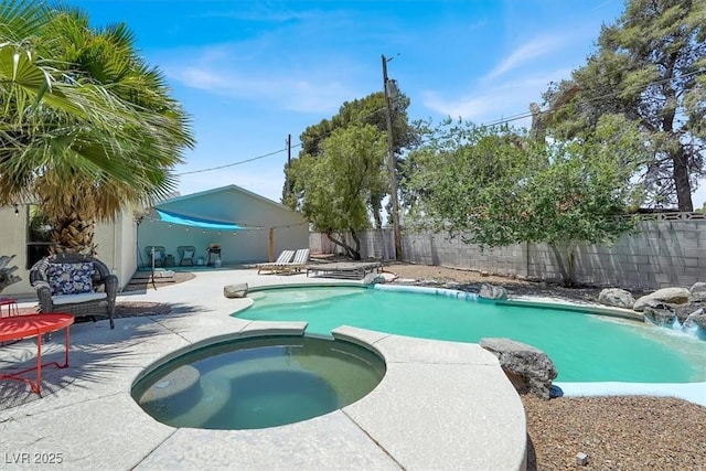 5008 Donnie Ave, Las Vegas, NV 89130 - view of swimming pool with a patio area, a fenced backyard, and a pool with connected hot tub