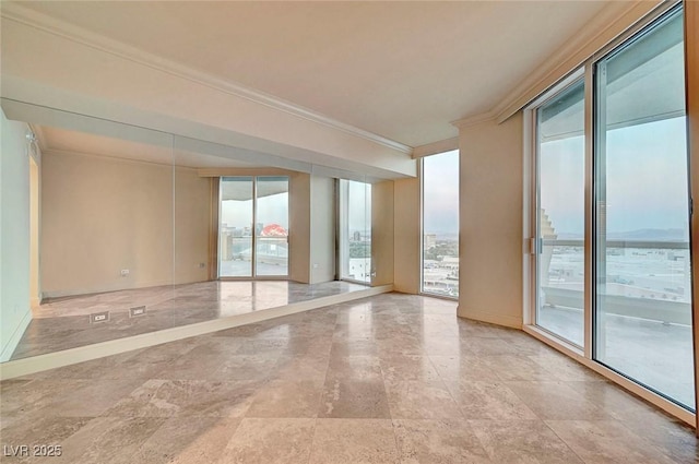 2877 Paradise Rd Unit 2105, Las Vegas, NV 89109 - empty room with ornamental molding and stone finish flooring