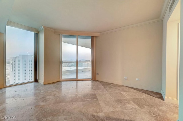 2877 Paradise Rd Unit 2105, Las Vegas, NV 89109 - spare room with ornamental molding, light stone finish flooring, and floor to ceiling windows