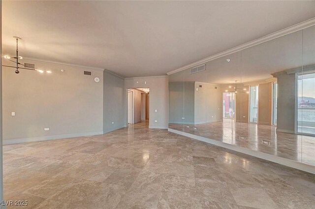 2877 Paradise Rd Unit 2105, Las Vegas, NV 89109 - empty room featuring crown molding, marble finish floors, and a chandelier