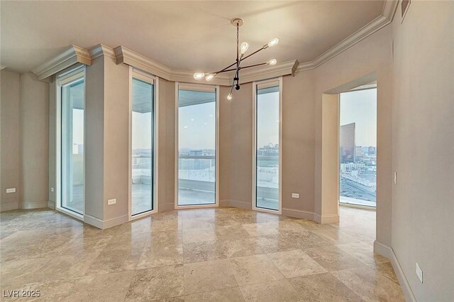 2877 Paradise Rd Unit 2105, Las Vegas, NV 89109 - unfurnished room featuring crown molding and a chandelier
