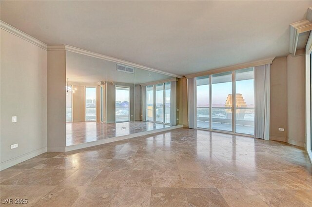 2877 Paradise Rd Unit 2105, Las Vegas, NV 89109 - spare room with stone finish floors, ornamental molding, and floor to ceiling windows