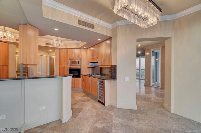 2877 Paradise Rd Unit 2105, Las Vegas, NV 89109 - kitchen with stainless steel appliances, a chandelier, ornamental molding, wine cooler, and a tray ceiling