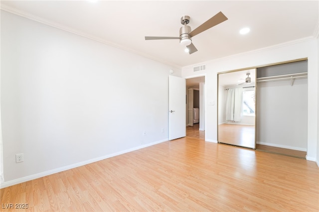 3060 Tarpon Dr Unit 104, Las Vegas, NV 89120 - unfurnished bedroom featuring ornamental molding, light wood-style flooring, a ceiling fan, and a closet