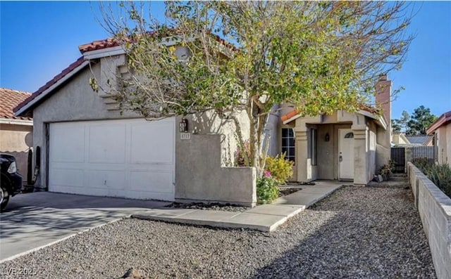 5317 Walton Heath Ave, Las Vegas, NV 89142 - view of front of house featuring stucco siding, concrete driveway, a tile roof, and an attached garage