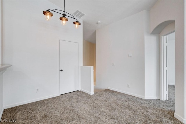 5521 Jackpot Winner Ln Unit 101, Las Vegas, NV 89122 - carpeted empty room featuring arched walkways and baseboards