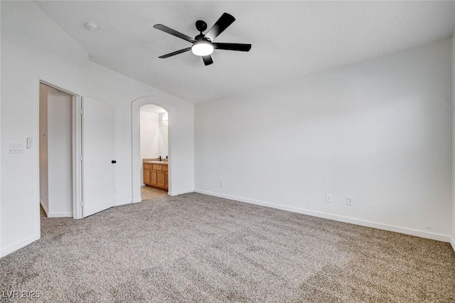 5521 Jackpot Winner Ln Unit 101, Las Vegas, NV 89122 - spare room with light colored carpet, arched walkways, a smoke detector, and a ceiling fan