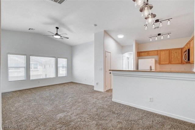 5521 Jackpot Winner Ln Unit 101, Las Vegas, NV 89122 - unfurnished living room with light carpet, lofted ceiling, a ceiling fan, and arched walkways