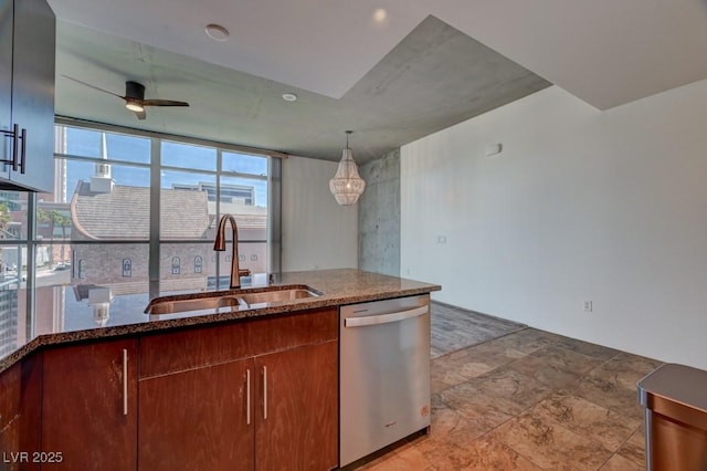 353 E Bonneville Ave Unit 313, Las Vegas, NV 89101 - kitchen with stainless steel dishwasher, dark stone counters, a ceiling fan, and hanging light fixtures