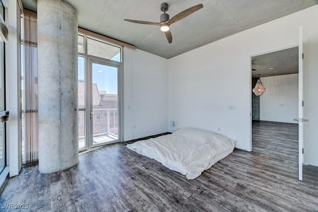 353 E Bonneville Ave Unit 313, Las Vegas, NV 89101 - empty room featuring wood finished floors, plenty of natural light, and a ceiling fan