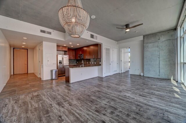 353 E Bonneville Ave Unit 313, Las Vegas, NV 89101 - unfurnished living room with ceiling fan, a chandelier, and dark wood finished floors