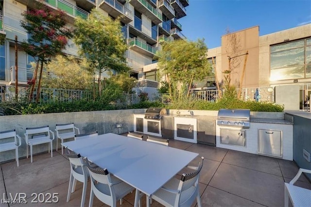 353 E Bonneville Ave Unit 313, Las Vegas, NV 89101 - view of patio with area for grilling and outdoor dining area