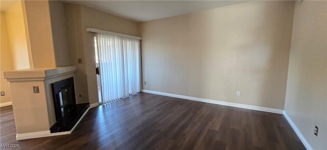 9000 Las Vegas Blvd Unit 1015, Las Vegas, NV 89123 - unfurnished living room with dark wood-type flooring and a glass covered fireplace