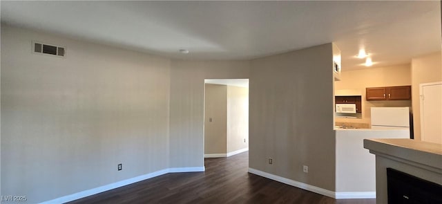 9000 Las Vegas Blvd Unit 1015, Las Vegas, NV 89123 - unfurnished living room featuring dark wood-style floors and baseboards