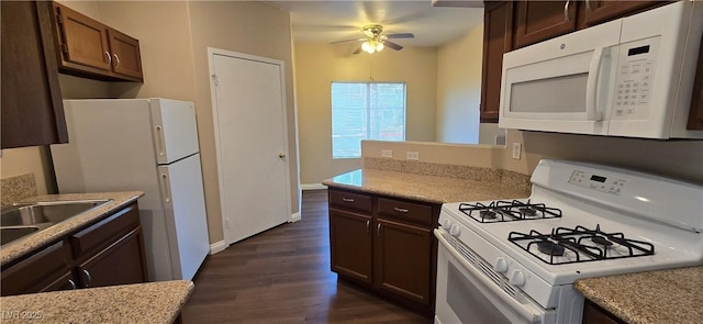 9000 Las Vegas Blvd Unit 1015, Las Vegas, NV 89123 - kitchen with white appliances, a ceiling fan, dark wood finished floors, and dark brown cabinets