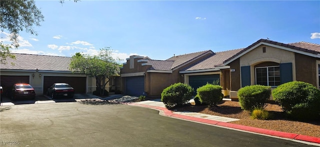 5045 Bayberry Crest St, North Las Vegas, NV 89031 - single story home with stucco siding, driveway, a garage, and a tile roof
