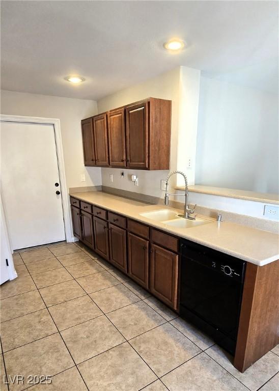 5045 Bayberry Crest St, North Las Vegas, NV 89031 - kitchen with black dishwasher, light countertops, a peninsula, light tile patterned floors, and recessed lighting
