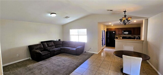 5045 Bayberry Crest St, North Las Vegas, NV 89031 - living area with vaulted ceiling, a chandelier, and light tile patterned floors