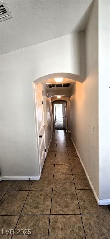 5045 Bayberry Crest St, North Las Vegas, NV 89031 - hall featuring arched walkways and tile patterned floors