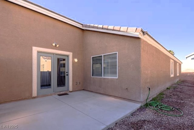 5045 Bayberry Crest St, North Las Vegas, NV 89031 - rear view of property featuring a patio and stucco siding