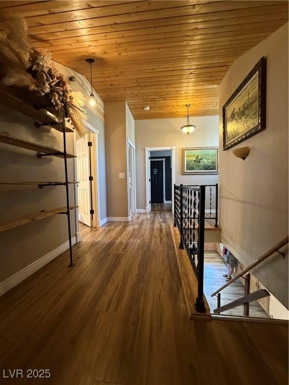 1829 Campton St, Ely, NV 89301 - hallway with wood ceiling, wood finished floors, and an upstairs landing