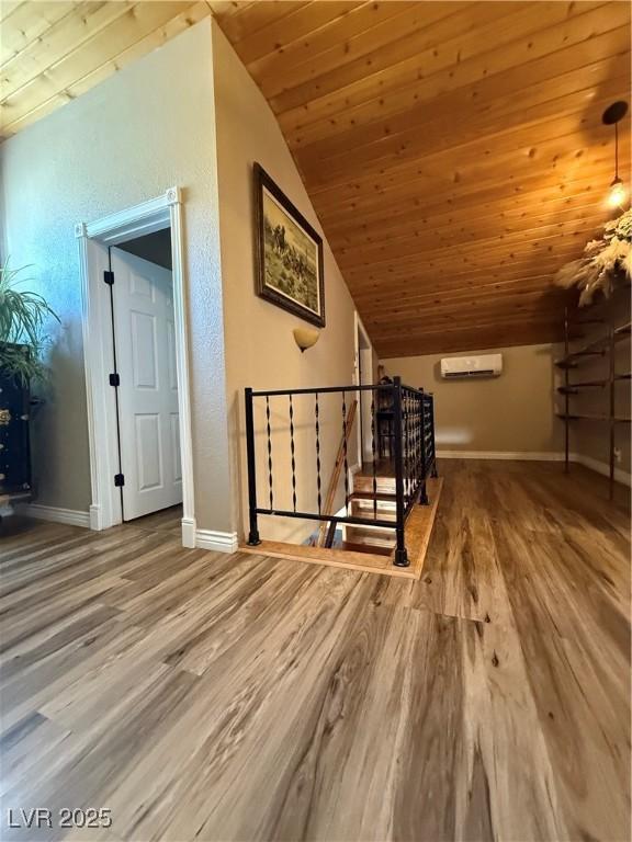 1829 Campton St, Ely, NV 89301 - bonus room with a wall unit AC, wood finished floors, lofted ceiling, and wooden ceiling