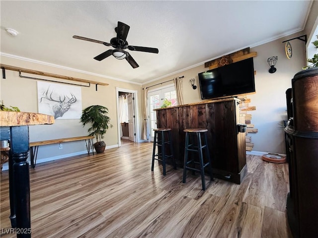 1829 Campton St, Ely, NV 89301 - bar area with wood finished floors, crown molding, and ceiling fan
