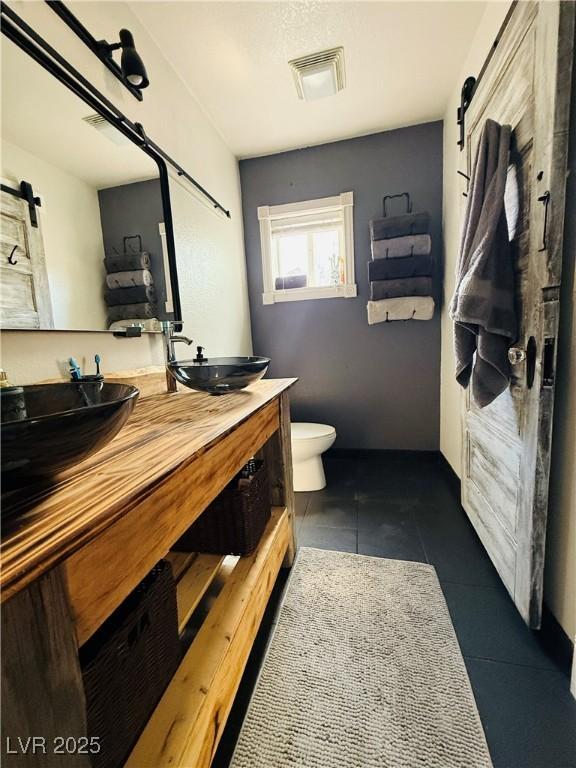 1829 Campton St, Ely, NV 89301 - full bath with tile patterned floors and double vanity