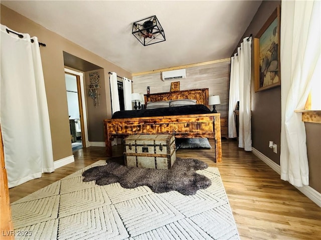 1829 Campton St, Ely, NV 89301 - bedroom with an AC wall unit and wood finished floors