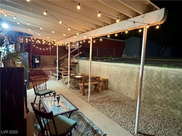 1829 Campton St, Ely, NV 89301 - patio at night with a patio, stairs, and a fire pit