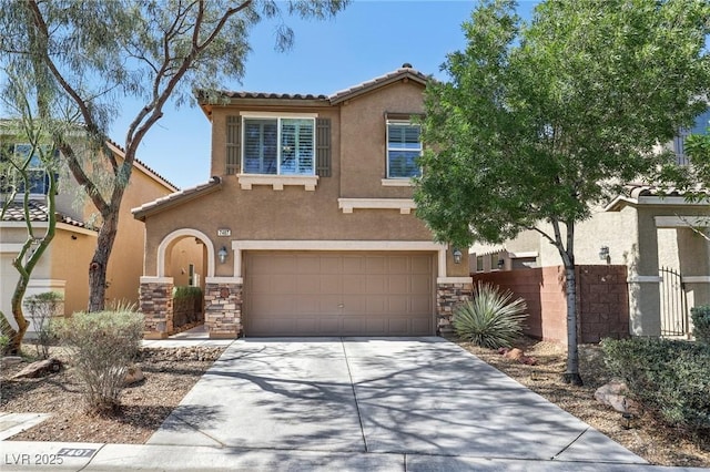 7407 Bakewell Ave, Las Vegas, NV 89179 - view of front of home with stucco siding, a garage, stone siding, and driveway