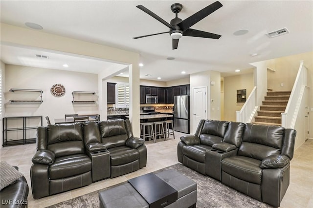 7407 Bakewell Ave, Las Vegas, NV 89179 - living area featuring ceiling fan, recessed lighting, stairway, and light tile patterned floors