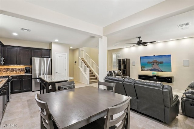 7407 Bakewell Ave, Las Vegas, NV 89179 - dining area with stairs, recessed lighting, a ceiling fan, and light tile patterned floors