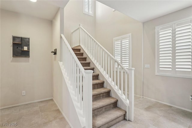 7407 Bakewell Ave, Las Vegas, NV 89179 - stairway featuring baseboards and tile patterned flooring