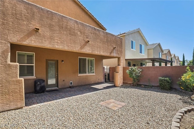 7407 Bakewell Ave, Las Vegas, NV 89179 - rear view of property with stucco siding and a patio