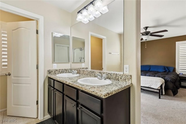7407 Bakewell Ave, Las Vegas, NV 89179 - ensuite bathroom with double vanity and a ceiling fan