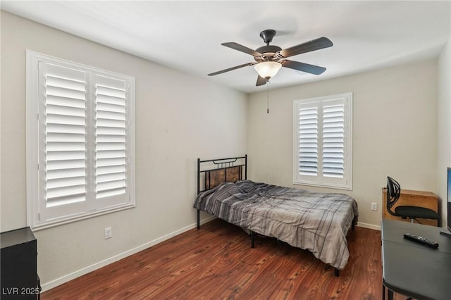 7407 Bakewell Ave, Las Vegas, NV 89179 - bedroom featuring wood finished floors, multiple windows, and ceiling fan