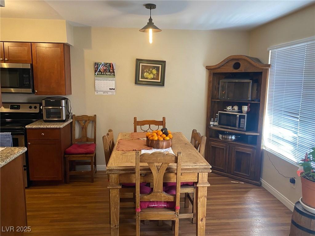 2750 S Durango Dr Unit 2141, Las Vegas, NV 89117 - dining area with dark wood finished floors and baseboards