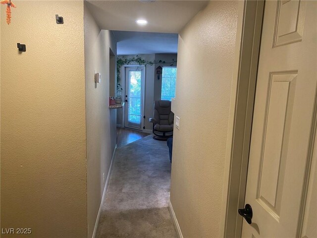 2750 S Durango Dr Unit 2141, Las Vegas, NV 89117 - hallway featuring a textured wall and dark carpet