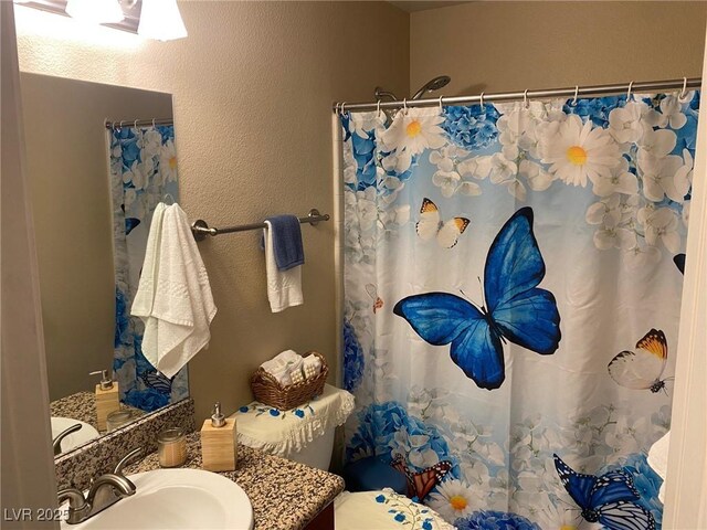 2750 S Durango Dr Unit 2141, Las Vegas, NV 89117 - bathroom featuring vanity and a shower with curtain