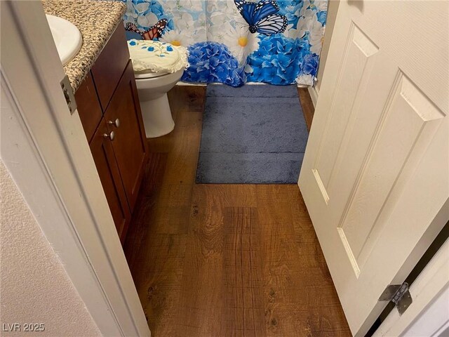 2750 S Durango Dr Unit 2141, Las Vegas, NV 89117 - bathroom featuring vanity, wood finished floors, and curtained shower