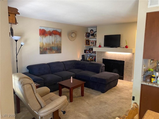2750 S Durango Dr Unit 2141, Las Vegas, NV 89117 - carpeted living area featuring a tile fireplace