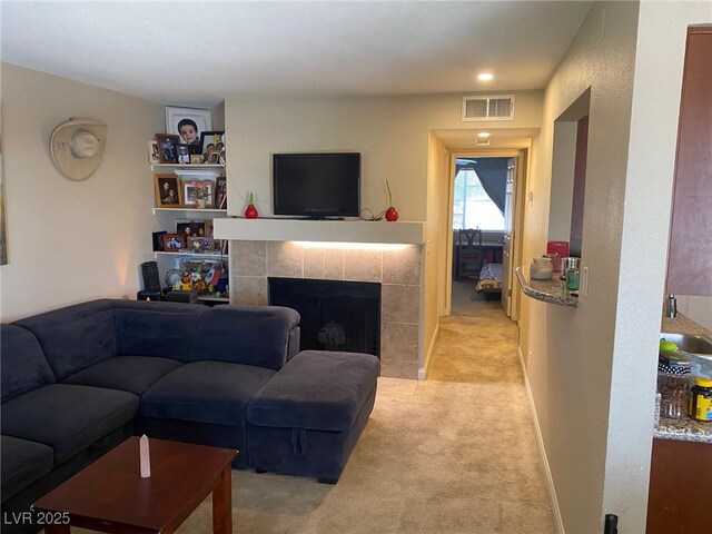 2750 S Durango Dr Unit 2141, Las Vegas, NV 89117 - living area featuring light carpet and a fireplace