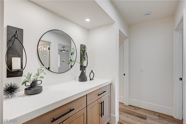8813 Sundial Dr, Las Vegas, NV 89134 - bathroom featuring wood finished floors, vanity, and recessed lighting