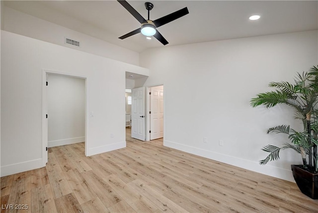 8813 Sundial Dr, Las Vegas, NV 89134 - unfurnished bedroom with lofted ceiling, light wood-style flooring, recessed lighting, a walk in closet, and ensuite bathroom