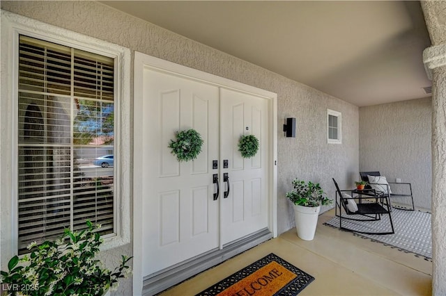 8813 Sundial Dr, Las Vegas, NV 89134 - property entrance featuring stucco siding