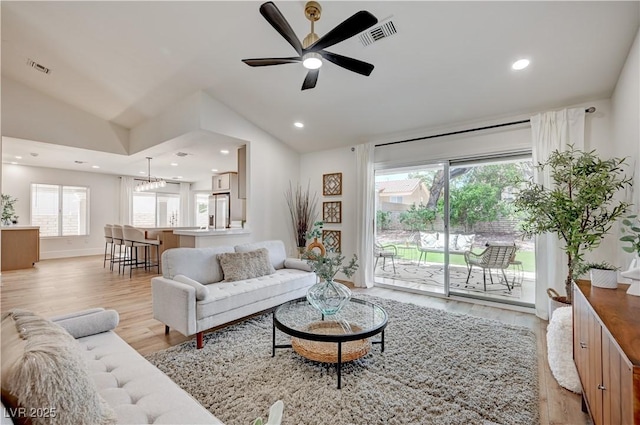 8813 Sundial Dr, Las Vegas, NV 89134 - living area featuring vaulted ceiling, light wood-style flooring, plenty of natural light, ceiling fan, and recessed lighting