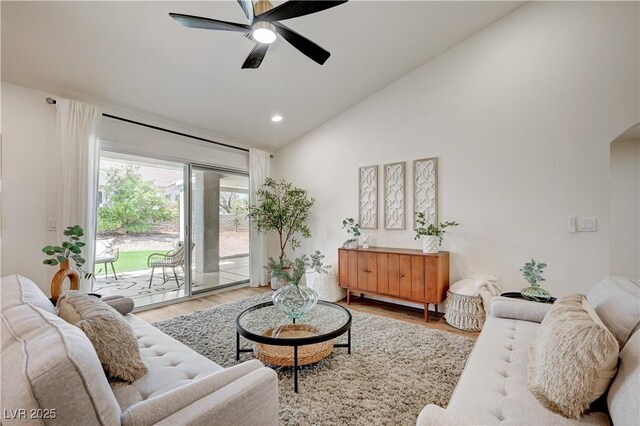 8813 Sundial Dr, Las Vegas, NV 89134 - living area with light wood finished floors, a ceiling fan, high vaulted ceiling, and recessed lighting