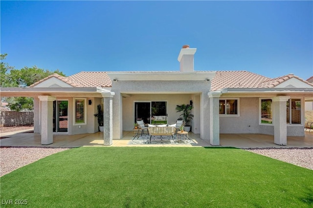 8813 Sundial Dr, Las Vegas, NV 89134 - rear view of property featuring a patio area, stucco siding, and a chimney