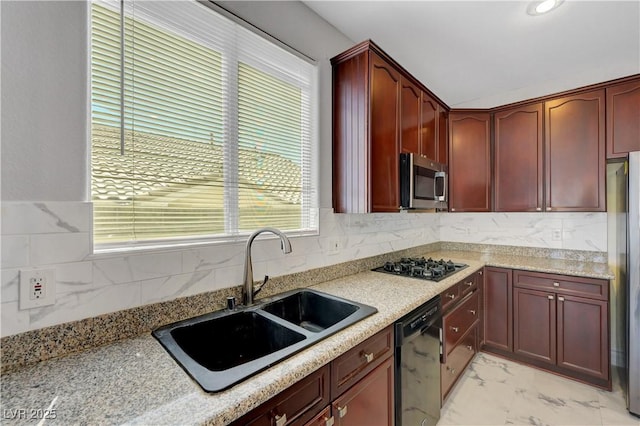 3079 Evening Mist Ave, Henderson, NV 89052 - kitchen with reddish brown cabinets, black appliances, light marble finish floors, and backsplash
